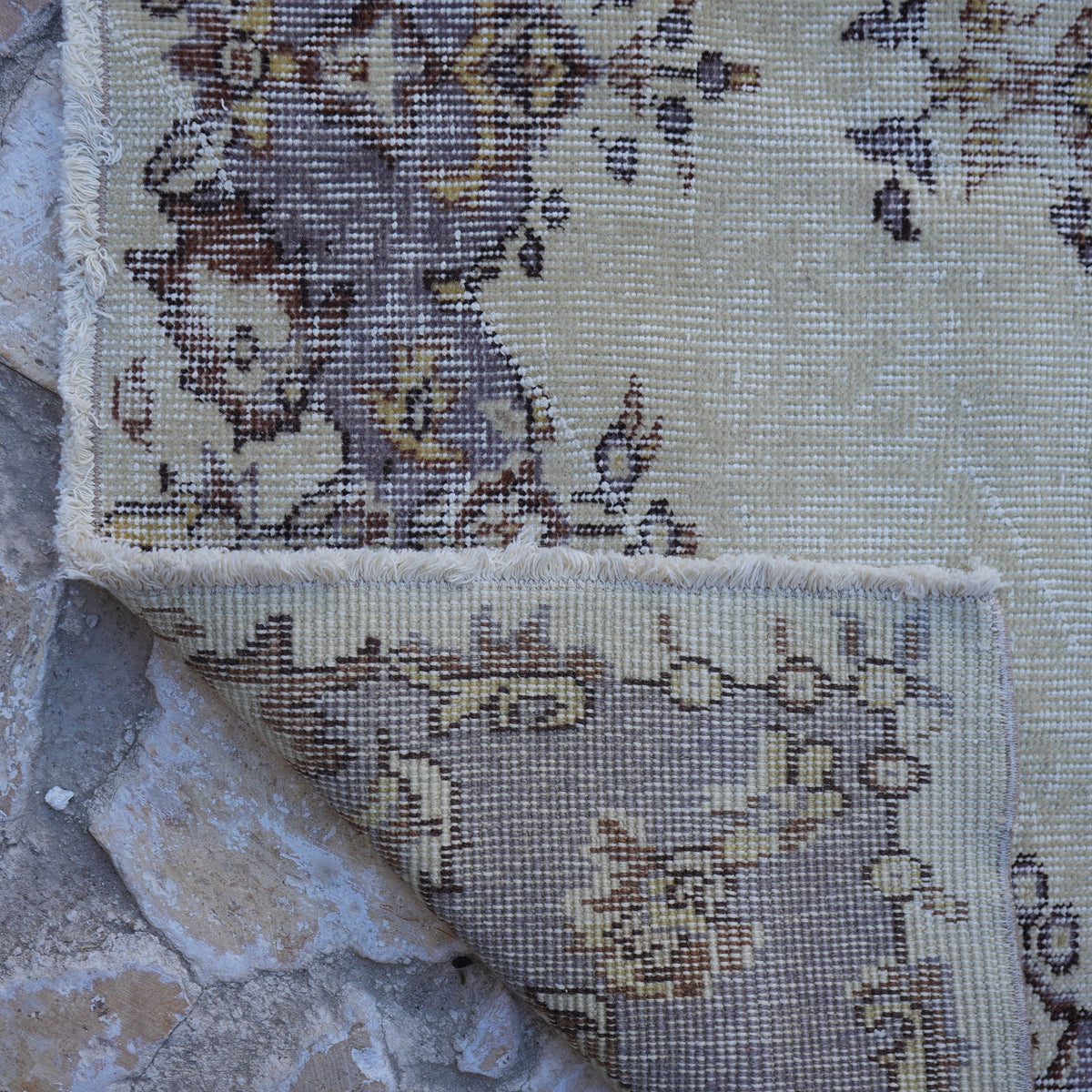 1970s purple vintage Turkish area rug with traditional design, hand-knotted weave and low pile.