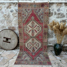 Red 4' x 9' vintage area rug with traditional design, handmade in Turkey – Micah.
