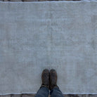 1970s beige vintage Turkish area rug with neutral design, hand-knotted weave and low pile.