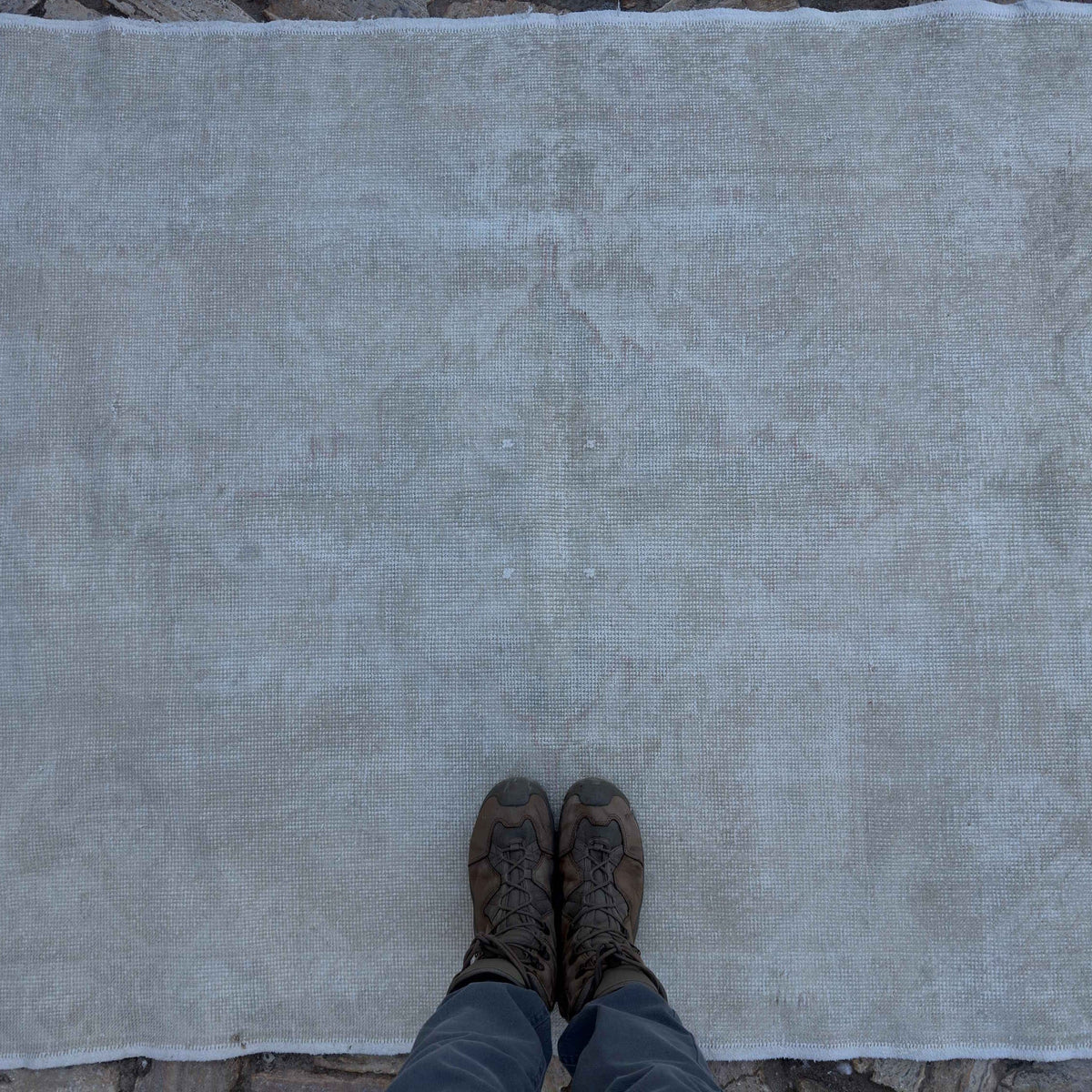 1970s beige vintage Turkish area rug with neutral design, hand-knotted weave and low pile.