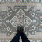 1970s pink vintage Turkish area rug with traditional design, hand-knotted weave and low pile.