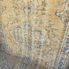 Blue 6' x 9' vintage Turkish area rug in wool and cotton, shown on the floor.