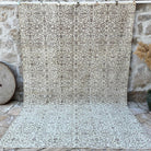 Beige 7' x 10' vintage area rug with floral and neutral design, handmade in Turkey – Macy.