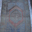 Close-up of the beige vintage Turkish area rug, hand-knotted weave, wool and cotton and low pile.
