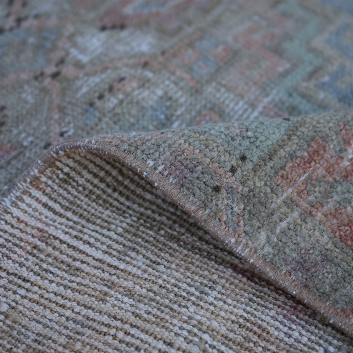 1970s beige vintage Turkish area rug, hand-knotted weave and low pile.