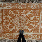 1970s pale orange vintage Turkish art deco rug with traditional and medallion design, hand-knotted weave and low pile.