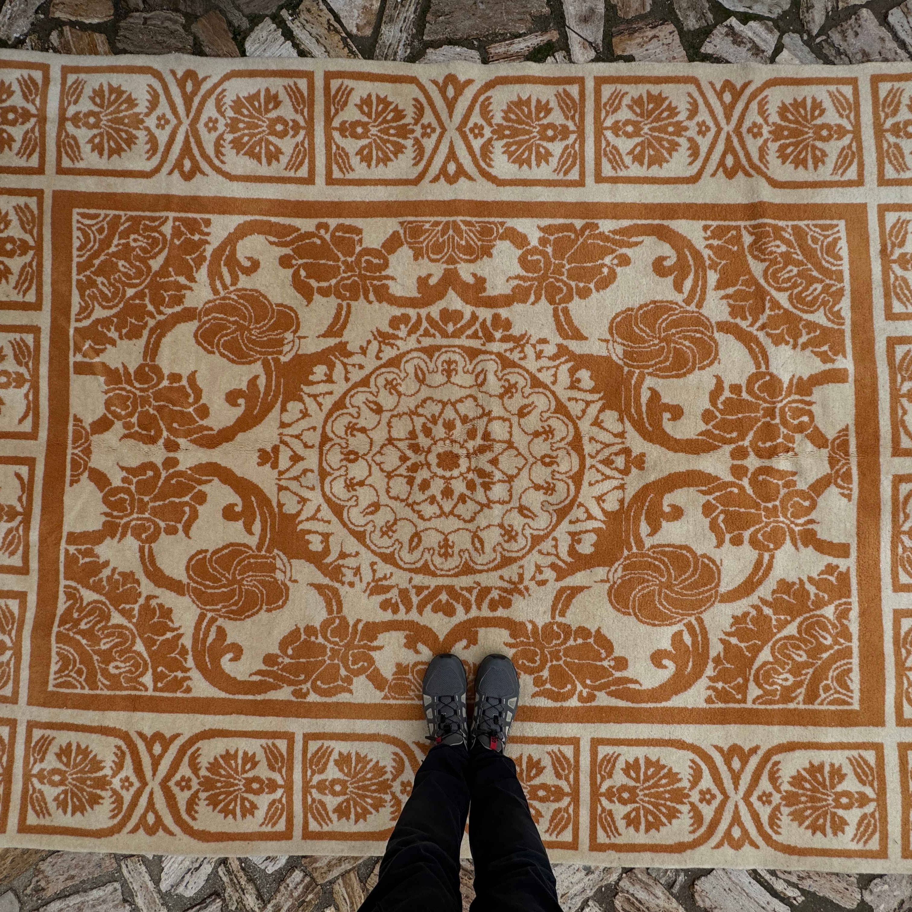 1970s pale orange vintage Turkish art deco rug with traditional and medallion design, hand-knotted weave and low pile.