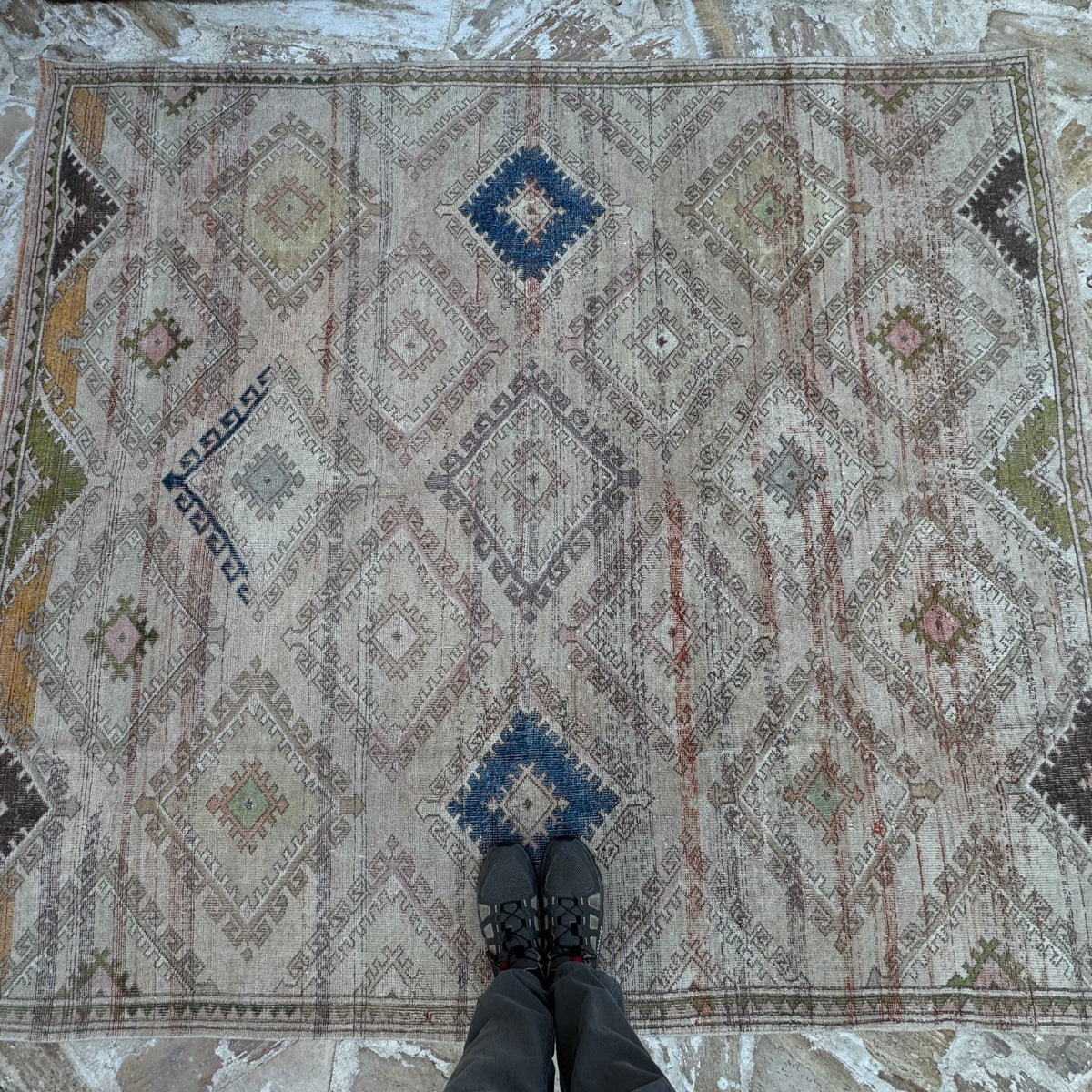 1970s beige vintage Turkish bohemian rug with traditional and neutral design, hand-knotted weave and low pile.