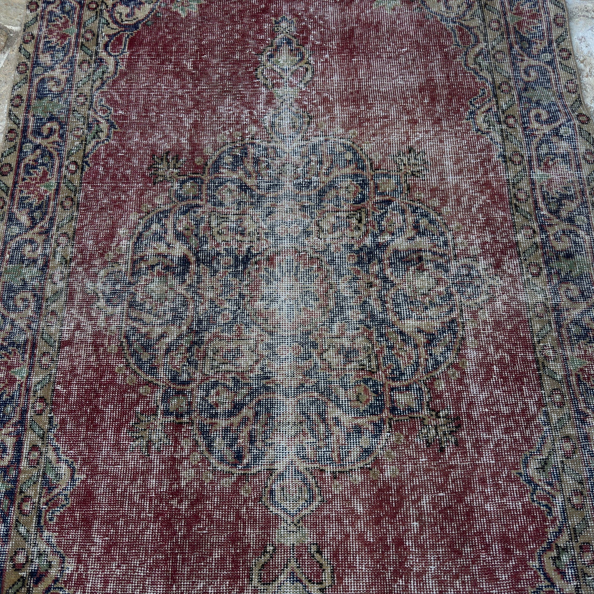 1970s red vintage Turkish decorative rug with medallion design, hand-knotted weave and low pile.
