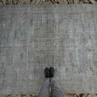1970s pale gray vintage Turkish distressed carpet with neutral design, hand-knotted weave and low pile.