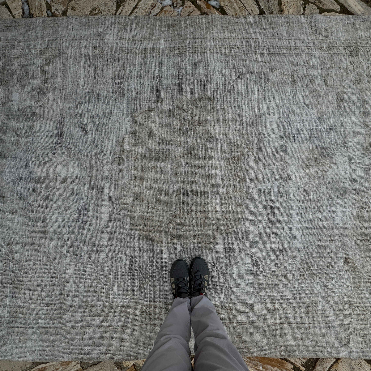 1970s pale gray vintage Turkish distressed carpet with neutral design, hand-knotted weave and low pile.
