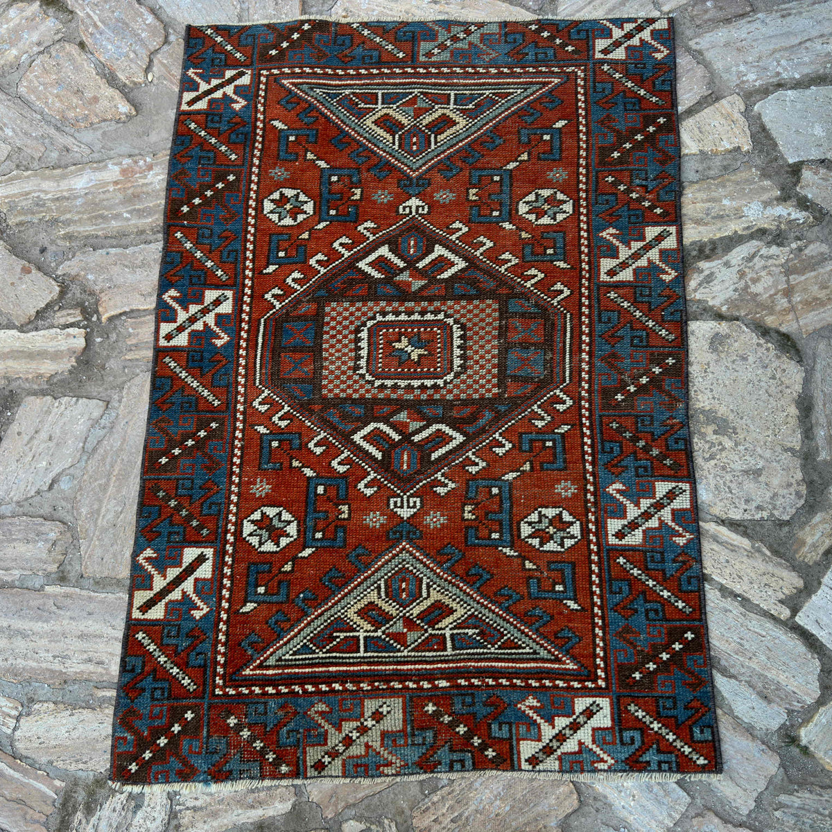 Red 3' x 4' vintage Turkish distressed rug in wool and cotton, shown on the floor.