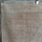 1970s beige vintage Turkish distressed rug with neutral design, hand-knotted weave and low pile.