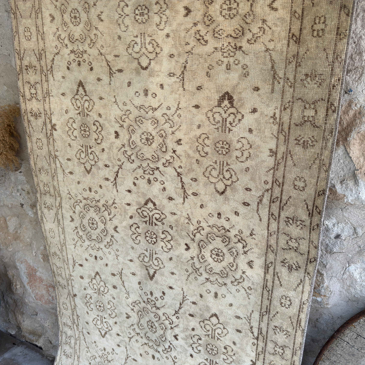 Beige 4' x 7' vintage Turkish distressed rug in wool and cotton, shown on the floor.