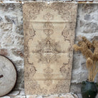 Beige 4' x 7' vintage distressed rug with neutral design, handmade in Turkey – Wally.