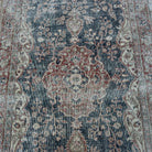 1970s blue vintage Turkish distressed rug with neutral design, hand-knotted weave and low pile.