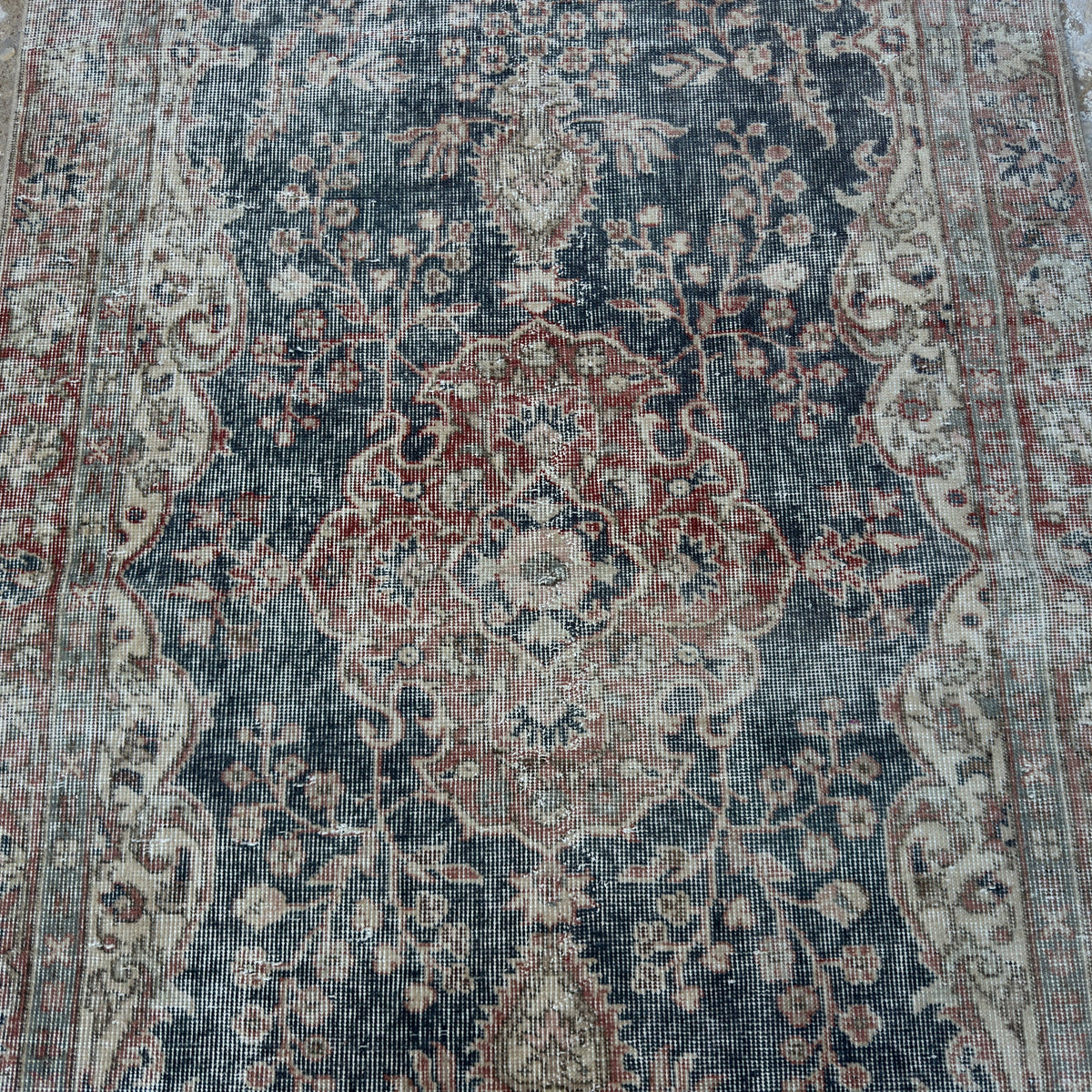 1970s blue vintage Turkish distressed rug with neutral design, hand-knotted weave and low pile.