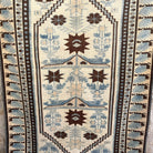 Blue 4' x 7' vintage Turkish distressed rug in wool and cotton, shown on the floor.