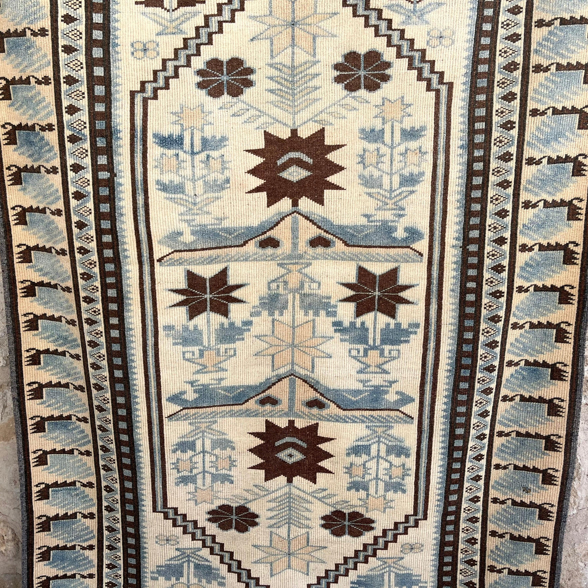 Blue 4' x 7' vintage Turkish distressed rug in wool and cotton, shown on the floor.