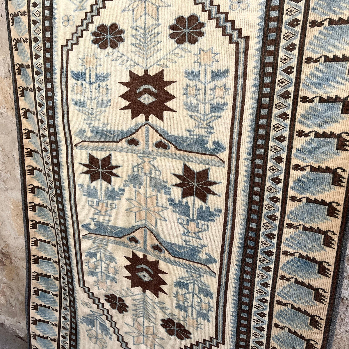 1970s blue vintage Turkish distressed rug with traditional design, hand-knotted weave and low pile.