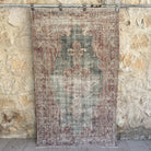 Blue 4' x 7' vintage distressed rug with traditional design, handmade in Turkey – Taha.