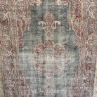 Blue 4' x 7' vintage Turkish distressed rug in wool and cotton, shown on the floor.