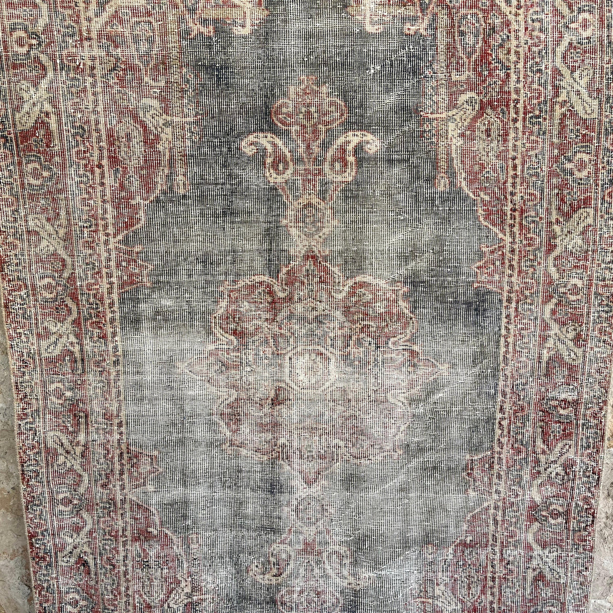 Blue 4' x 7' vintage Turkish distressed rug in wool and cotton, shown on the floor.