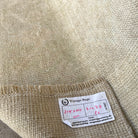 Close-up of the brown vintage Turkish distressed rug showing neutral details, hand-knotted weave, wool and cotton and low pile.