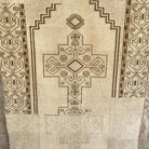 Brown 4' x 7' vintage Turkish distressed rug in wool and cotton, shown on the floor.