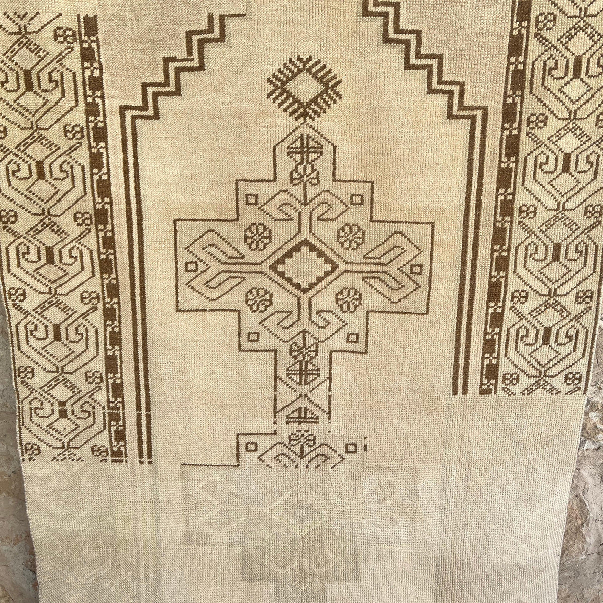 Brown 4' x 7' vintage Turkish distressed rug in wool and cotton, shown on the floor.