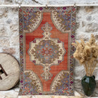 Pale Red 4' x 7' vintage distressed rug with traditional design, handmade in Turkey – Easton.