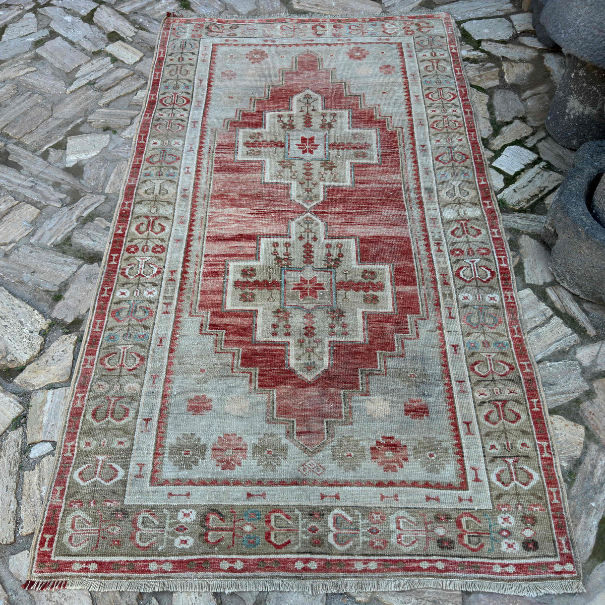 Red 4' x 7' vintage Turkish distressed rug in wool and cotton, shown on the floor.