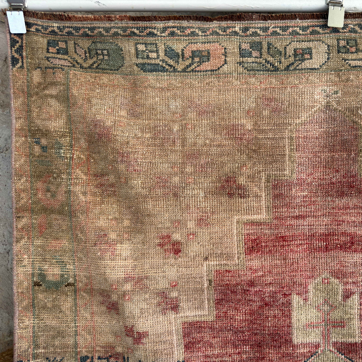 Red 4' x 7' vintage Turkish distressed rug in wool and cotton, shown on the floor.