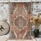Orange 4' x 8' vintage distressed rug with traditional design, handmade in Turkey – Eastman.
