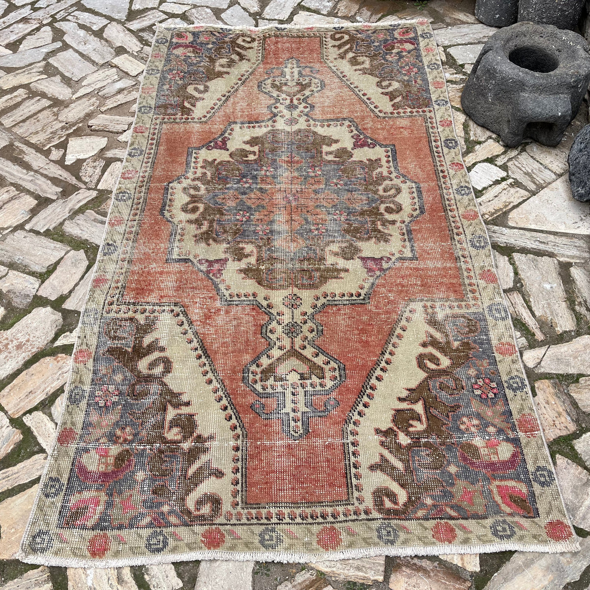 Orange 4' x 8' vintage Turkish distressed rug in wool and cotton, shown on the floor.