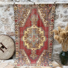 Red 5' x 7' vintage distressed rug with traditional design, handmade in Turkey – Jameson.