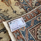 1970s beige vintage Turkish distressed rug with traditional design, hand-knotted weave and low pile.