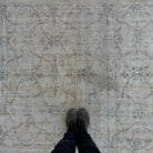 1970s beige vintage Turkish distressed rug with floral design, hand-knotted weave and low pile.