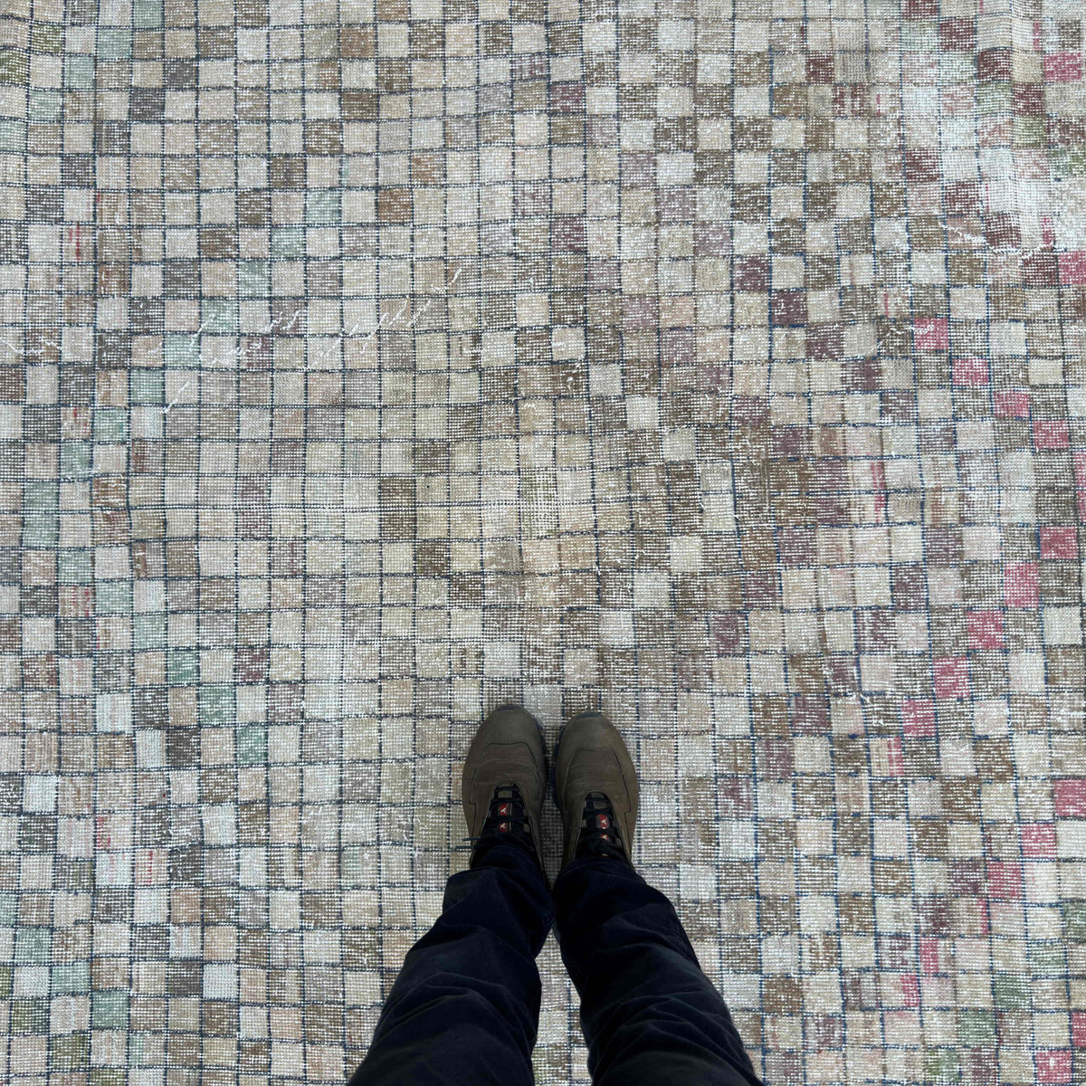 1970s pink vintage Turkish distressed rug with traditional design, hand-knotted weave and low pile.