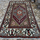 Pale Green 5' x 9' vintage Turkish distressed rug in wool and cotton, shown on the floor.