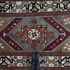 1970s pale green vintage Turkish distressed rug with traditional design, hand-knotted weave and low pile.