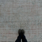 1970s pale pink vintage Turkish distressed rug with medallion design, hand-knotted weave and low pile.