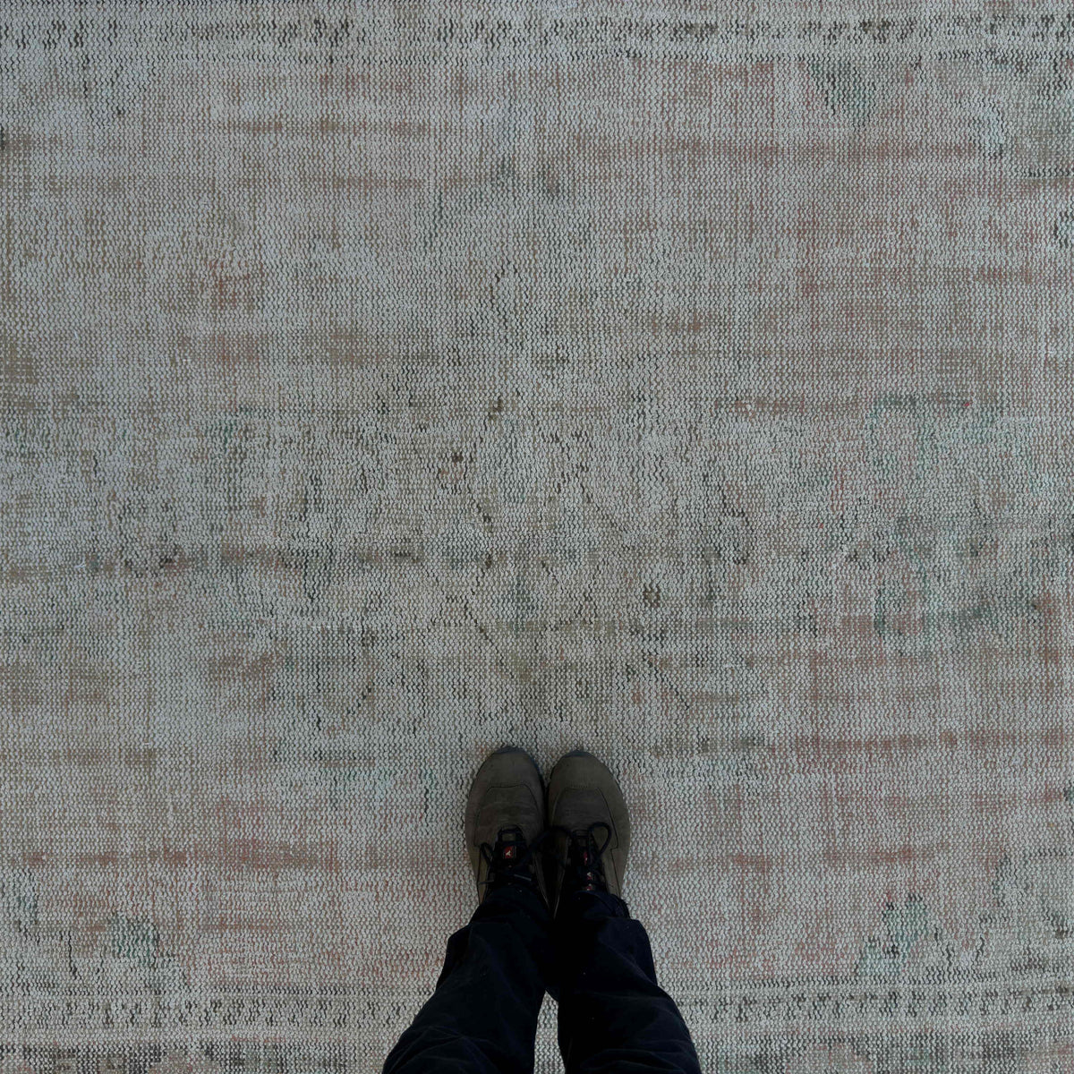 1970s pale pink vintage Turkish distressed rug with medallion design, hand-knotted weave and low pile.
