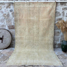Beige 6' x 10' vintage distressed rug with neutral design, handmade in Turkey – Birtle.