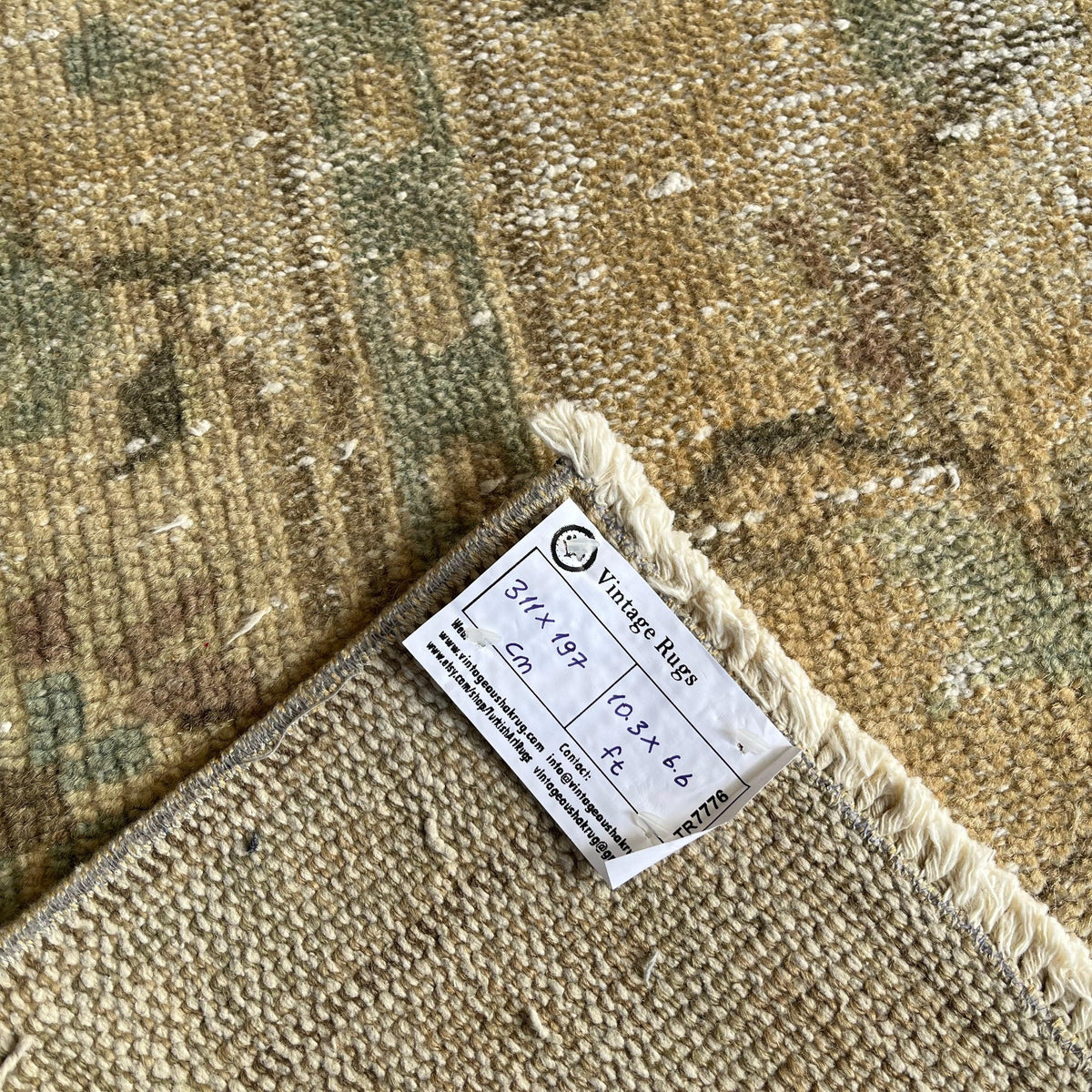 1970s beige vintage Turkish distressed rug with medallion design, hand-knotted weave and low pile.