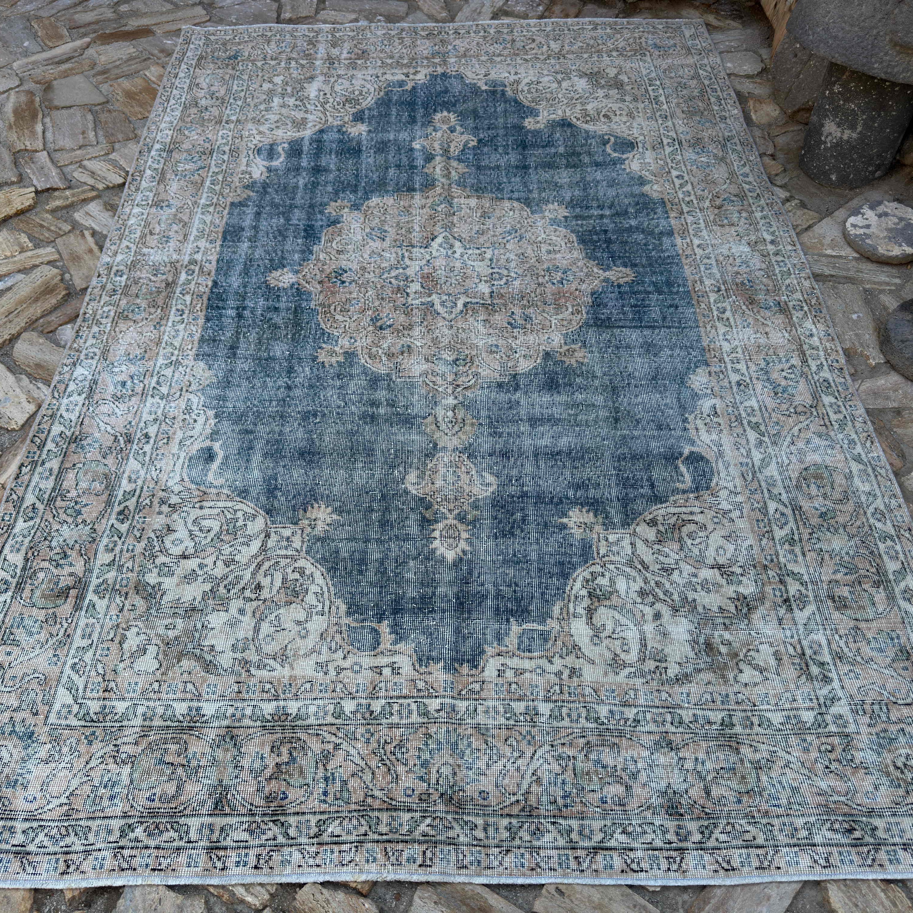 Blue 6' x 10' vintage Turkish distressed rug in wool and cotton, shown on the floor.