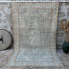 Blue 6' x 10' vintage distressed rug with neutral design, handmade in Turkey – Tiana.