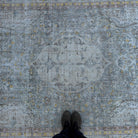 1970s blue vintage Turkish distressed rug with neutral design, hand-knotted weave and low pile.