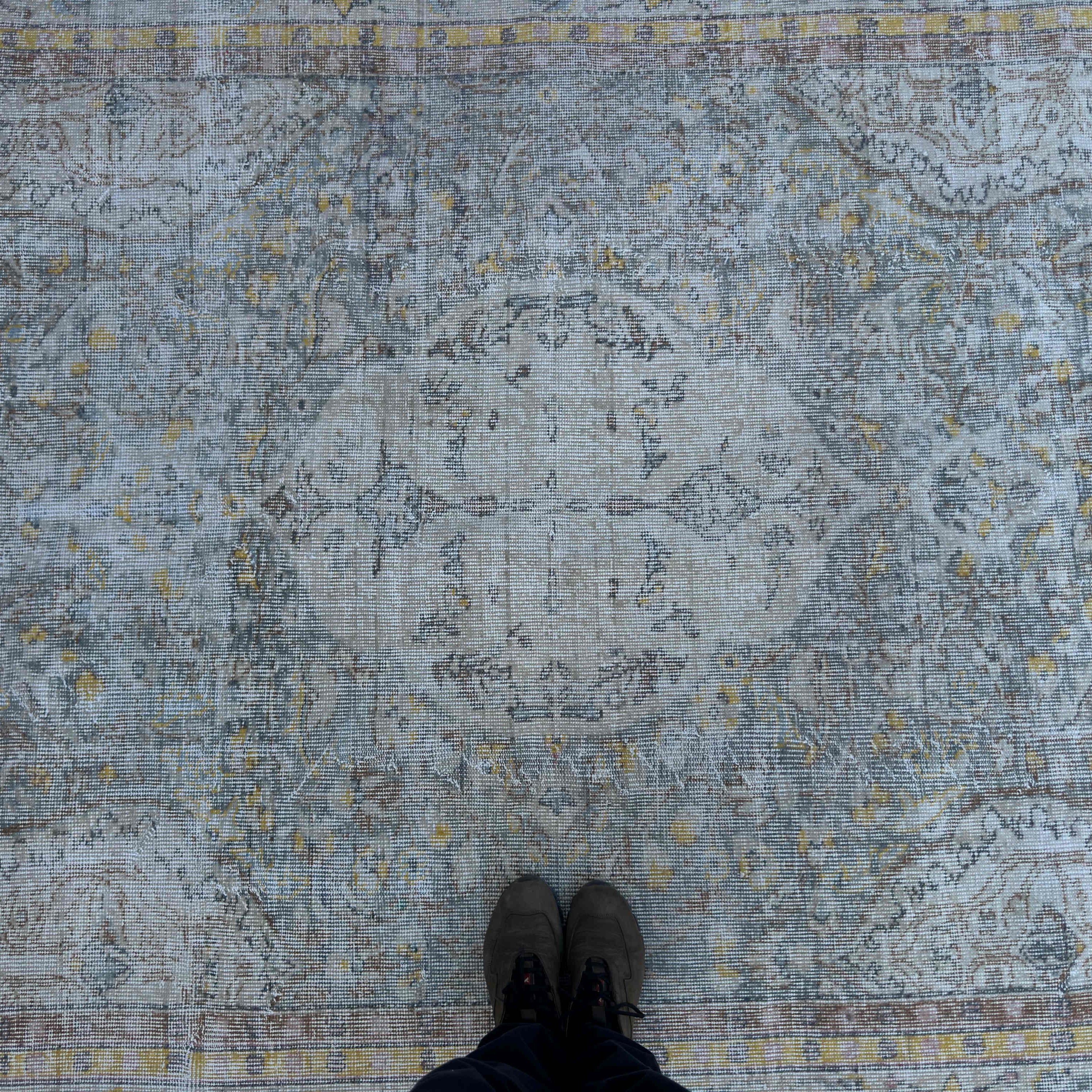 1970s blue vintage Turkish distressed rug with neutral design, hand-knotted weave and low pile.