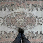 1970s pink vintage Turkish distressed rug with medallion design, hand-knotted weave and low pile.
